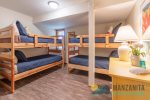 Double bunkbed room is on entry floor next to bathroom and downstairs king room. 
